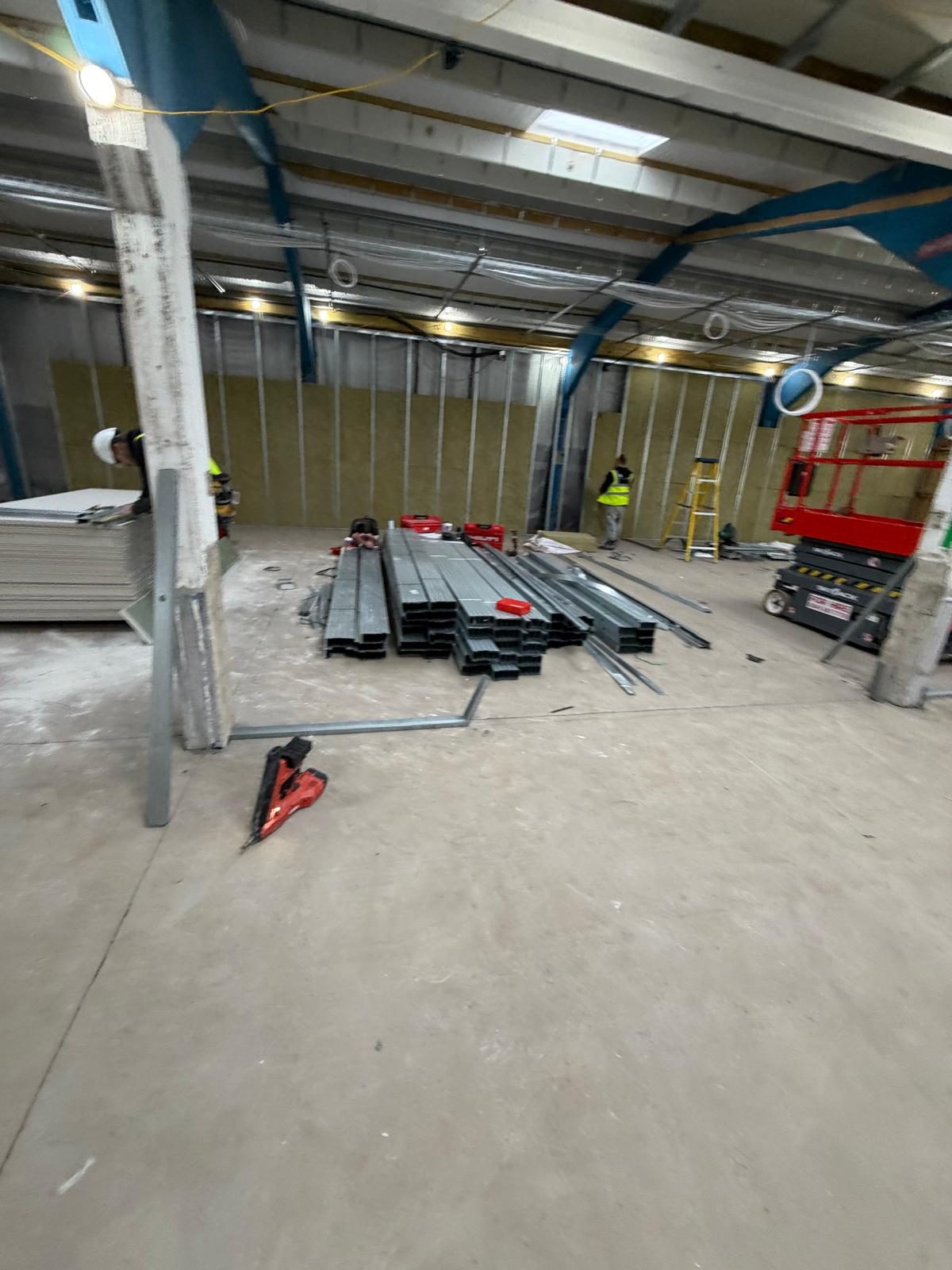 Bare structural shell, partitioning materials on site, Atlantic Plastics, JLG Construction Services