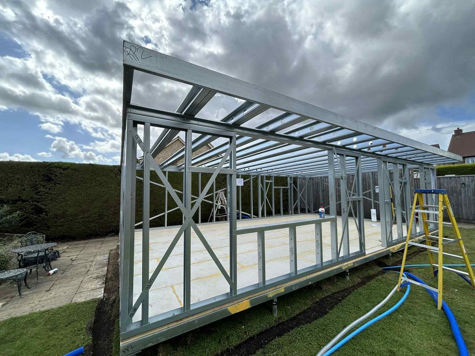 Galvanised steel frame erected on the base — JLG Construction Services
