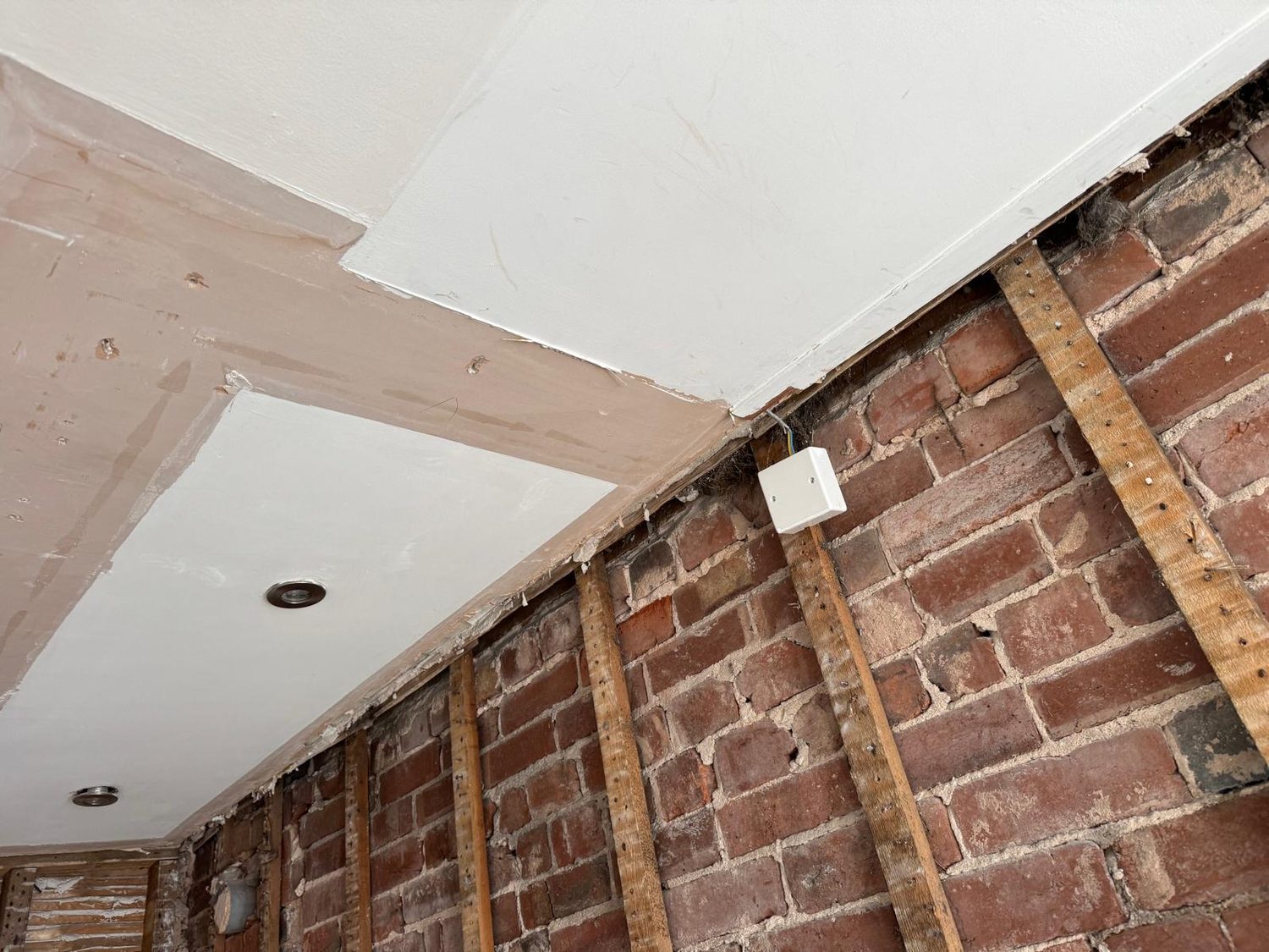 Ceiling and wall junction drylined and made good, JLG Construction Services